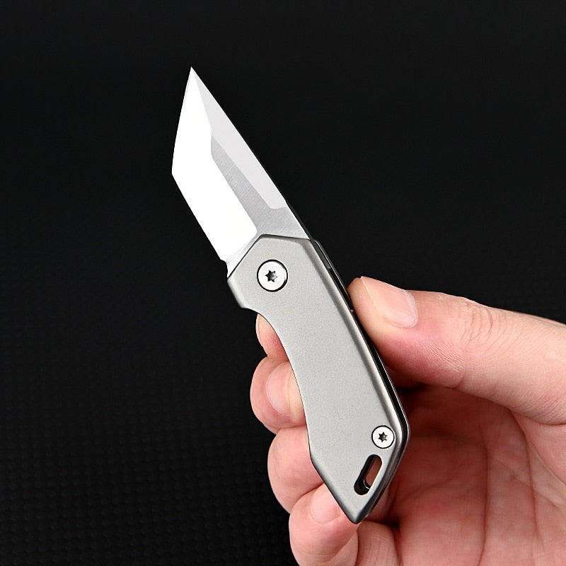 SteelNomad | Compact Titanium Keychain Knife for Travel and Utility 1