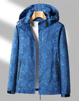 Women's Lightweight Waterproof Outdoor Jacket with Adjustable Hood and Zippered Pockets